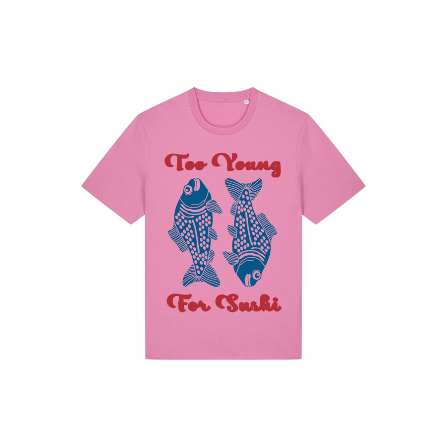 The STTU169 Stanley/Stella Creator 2.0 T-shirt in Bubble Pink (C129) is made from soft, organic cotton with a single jersey fabric. It showcases a playful design featuring two blue fish illustrations and the bold red text, "Too Young For Sushi.