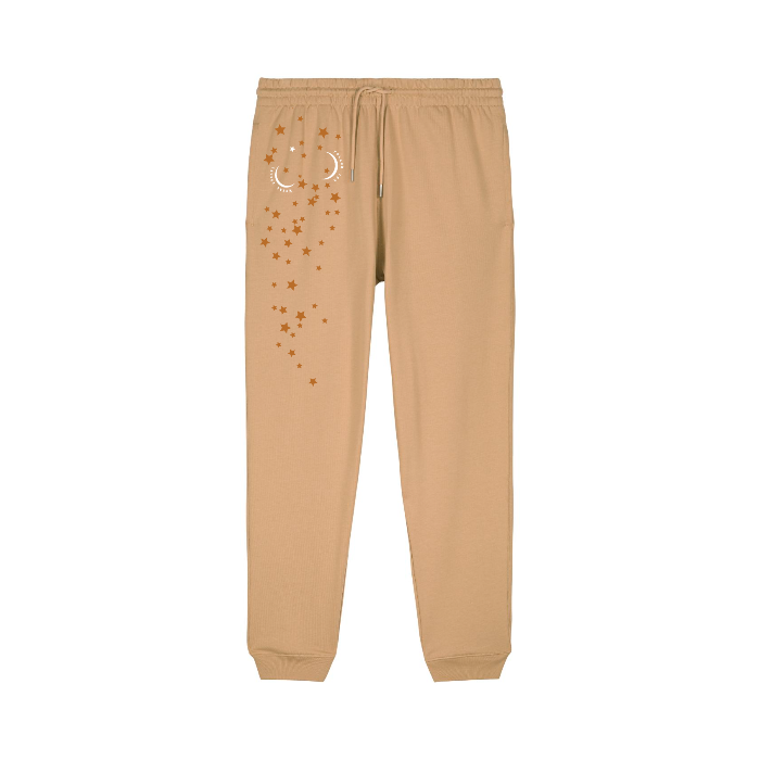 The STBU185 Stella/Stella Mover 2.0 Iconic Unisex Jogger Pants by Stanley/Stella are tan with a drawstring waist, crafted from brushed fleece, and feature star and crescent moon designs for supreme comfort and style.