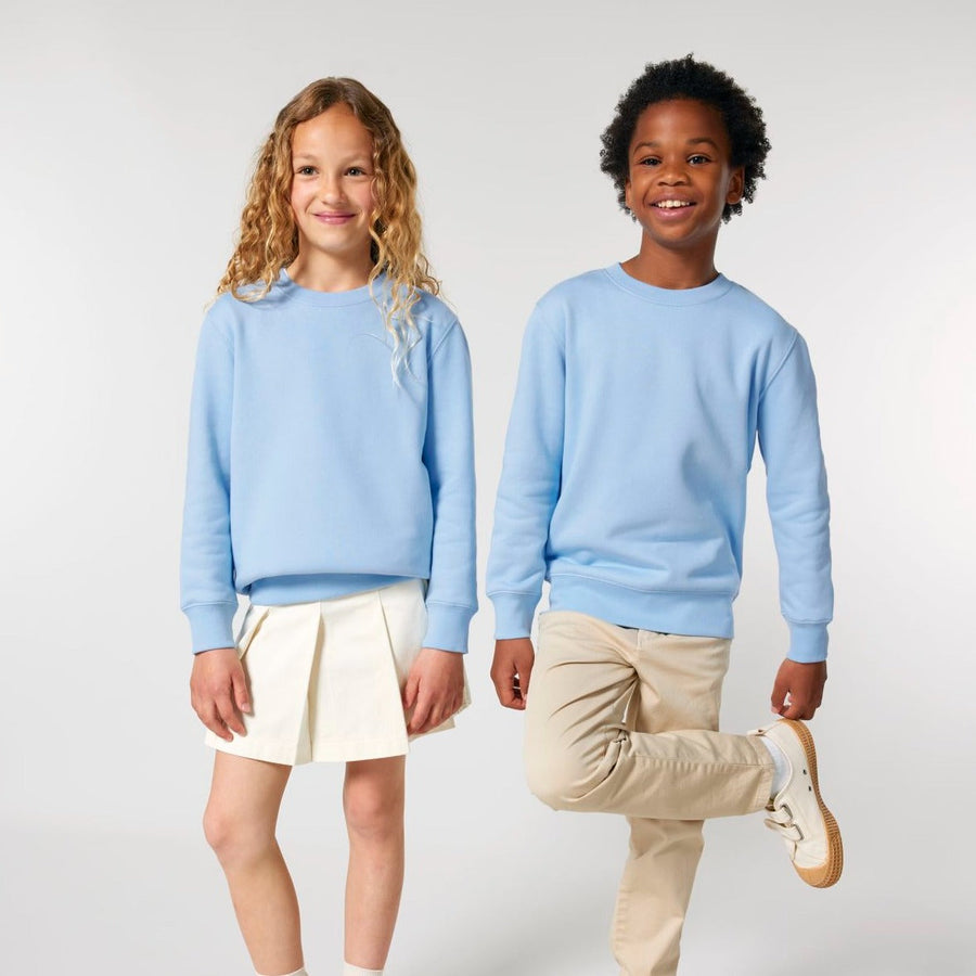 A boy and girl in matching STSK181 Stella/Stella Mini Changer 2.0 The Iconic Kids’ Crew Neck Sweatshirt outfits.